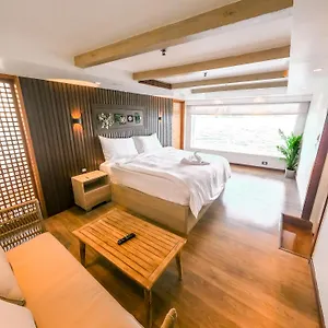 Spacious guest room aboard Queens by TIME