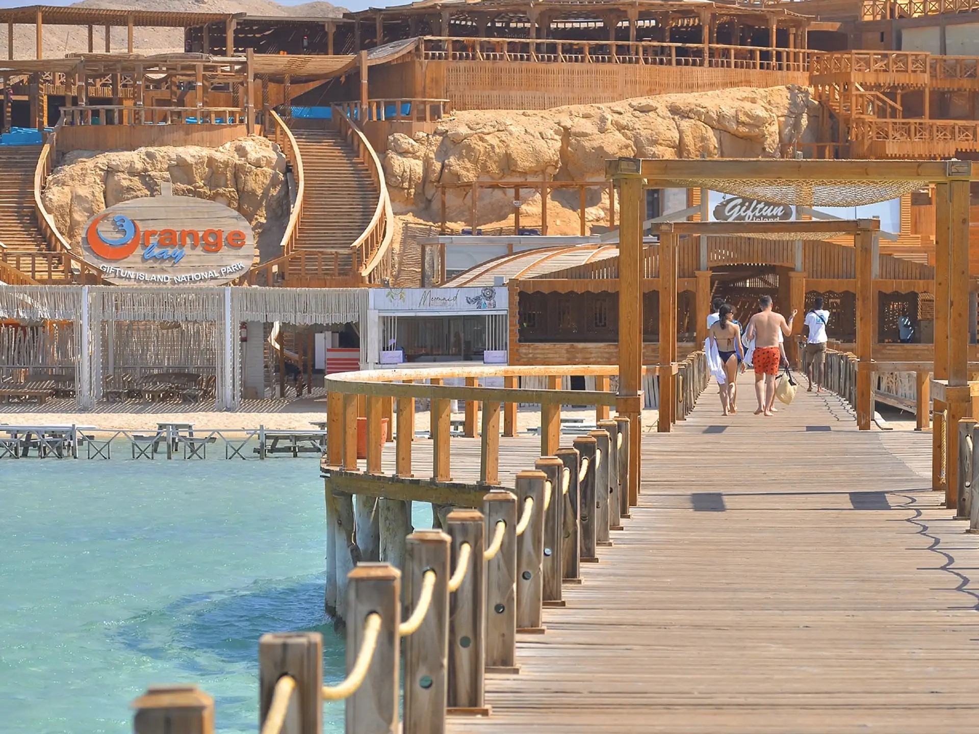Orange Bay beach club and wooden boardwalk