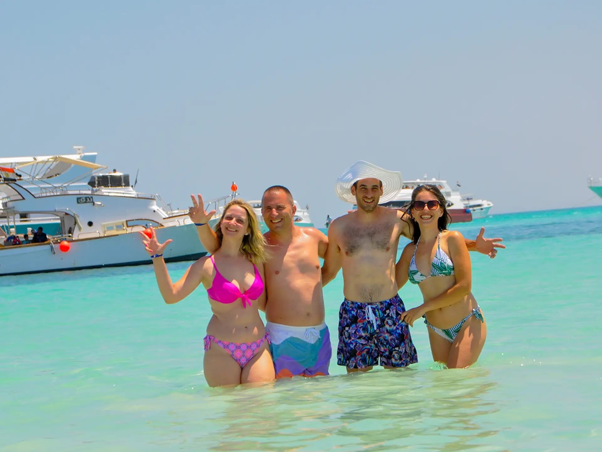 Family snorkeling in clear Red Sea waters